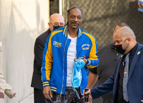 Snoop Dogg's Olympic Torch Post Sparks Viral Cannabis Memes