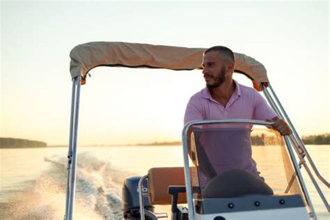 Man Driving Boat Lake Stock Photos Pictures And Royalty Free Images Istock