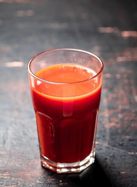 Premium Photo Juice From Ripe Tomatoes In A Glass