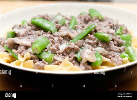 Ground Beef Hamburger Stroganoff With Chopped Snap Peas And Broad Egg Noodles In A Mushroom