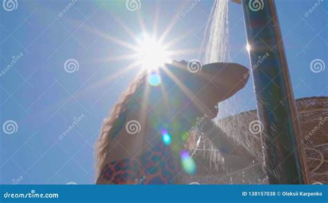 Woman Has An Outdoor Beach Shower With Fresh Water In Slow Motion On