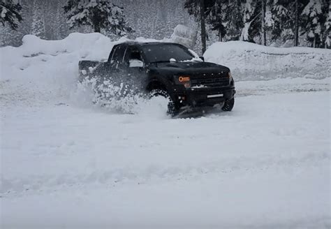 Ford Raptor Rips Through The Snow With Barking V8 Power