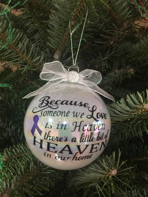 A Christmas Ornament Hanging On A Tree With The Words Because Someone