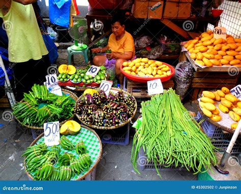 Market Vendor Selling Vegetables In A Market In Philippines Editorial