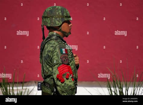 A Closeup Of A Mexican Soldier In Combat Helmet And Camouflage During A