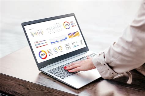 Premium Photo Woman With Laptop And Financial Charts At Screen