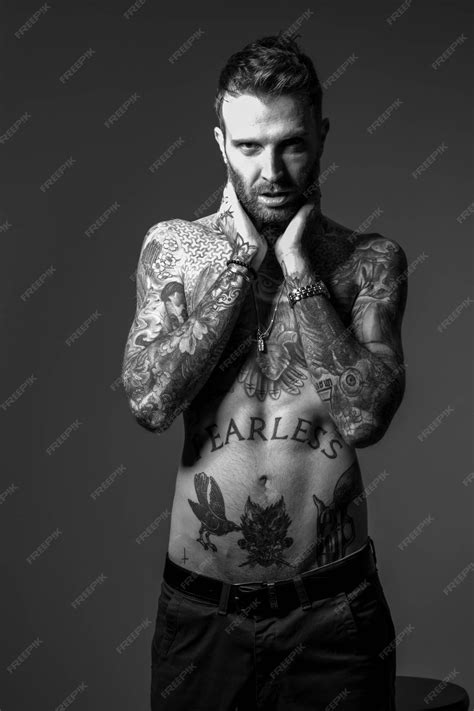 Premium Photo | A man with tattoos that says'the king'on it