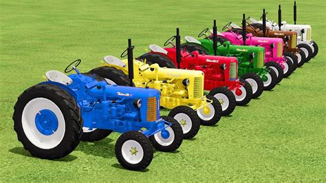 TRANSPORTING SPREADING LIME With COLORED JOHN DEERE LAWN TRACTORS