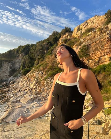 Dua Lipa Shares Pics In Black Swimwear Amid Scenic Backdrop