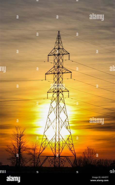 electric poles in the sunset Stock Photo - Alamy