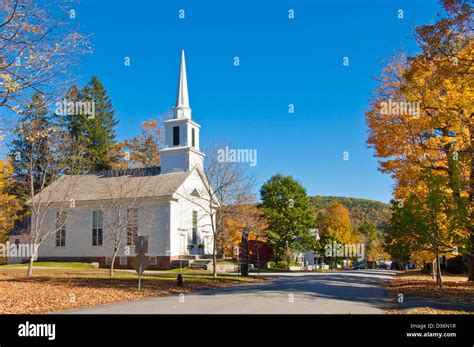 Autumn fall colours colors around traditional white timber clad church ...