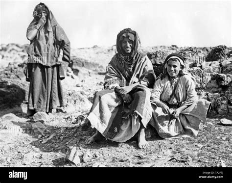 Three Members Of A Nomadic Bedouin Tribe In The Judean Desert In Today