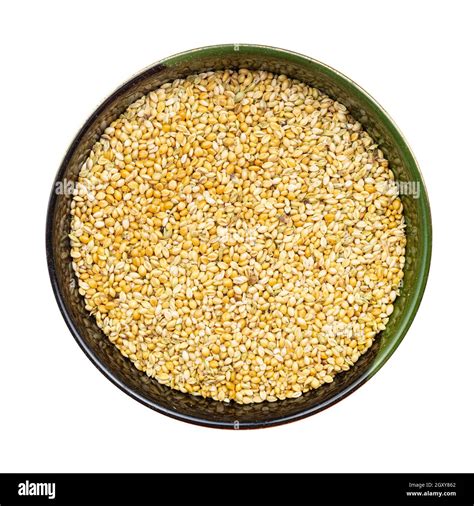 Top View Of Whole Grain Foxtail Millet Seeds In Round Bowl Isolated On