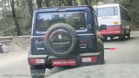 Maruti Jimny Spied Next To Thar New Blue Colour Dealer Display Schedule