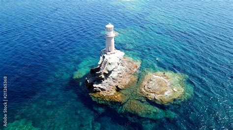 Aerial Drone Birds Eye View Of Iconic Lighthouse Of Tourlitis In Port