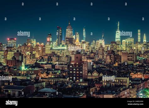 New York Skyscrapers Panorama At Night City Lights With Blue Sky