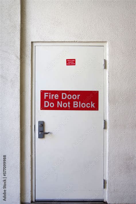 Fire safety exit door with signage Stock Photo | Adobe Stock