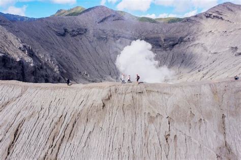 Premium Photo | Tourist walking on mount bromo crater