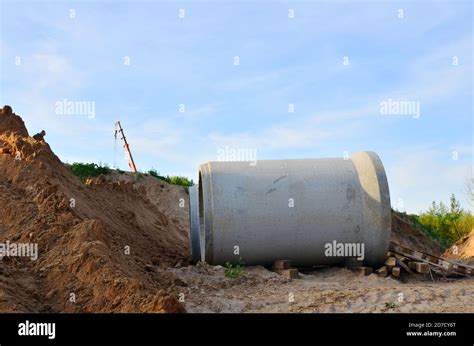 Laying of underground storm sewer pipes at construction site ...