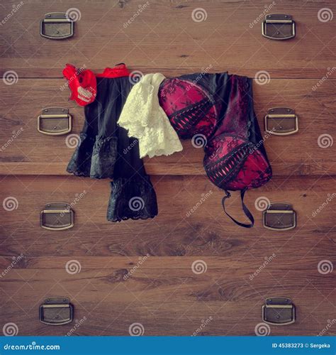 Lingerie Hanging on the Dresser Stock Image - Image of dresser, room