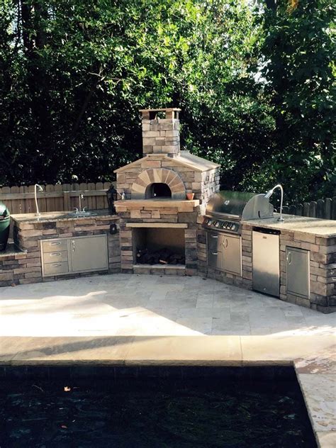 outdoor kitchen with a wood fired pizza oven Pizza Oven Outdoor Kitchen, Brick Oven Outdoor ...