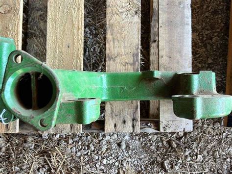 Nos John Deere Exhaust Manifold Aumann Auctions Inc