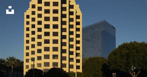 A Tall Building Sitting Next To A Tall Building Photo Free Usa Image