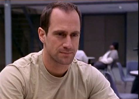 a man sitting at a table in an office setting