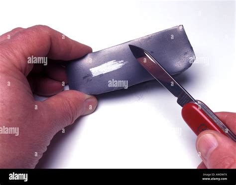 scraping  surface  lead  reveal  shiny surface stock photo alamy
