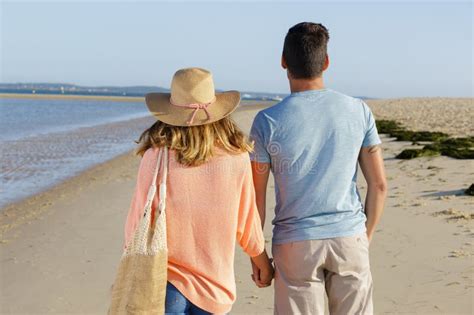 Couple Walking Along Sea Shore Stock Image Image Of Lifestyle