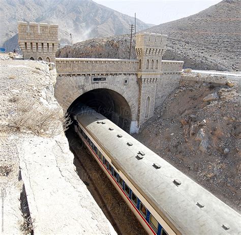 A Train Entering A Tunnel In The Desolate Hilly Area Of Bolan Pass In