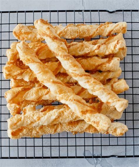 Pile Of Cheese Strawson A Cooling Rack With Two Sitting On The Top