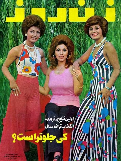 Two Women In Colorful Dresses Standing Next To Each Other On The Cover