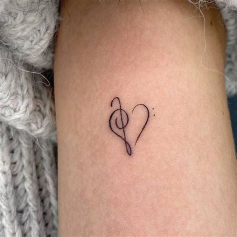 Bass And Treble Clef Heart Tattooed On The Inner Arm Music Heart