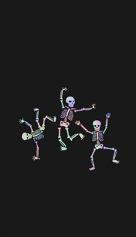 three skeletons dancing in the dark with one skeleton holding up his ...