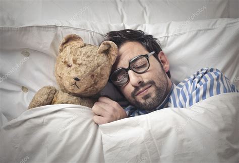 Man Sleeping In Bed With Teddy Bear