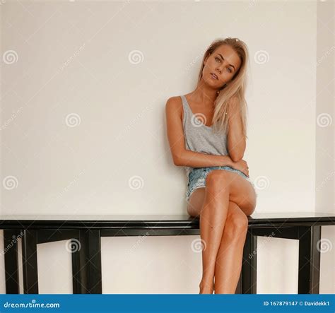 Beautiful Woman Sitting On Table Stock Image Image Of Girl Relaxing