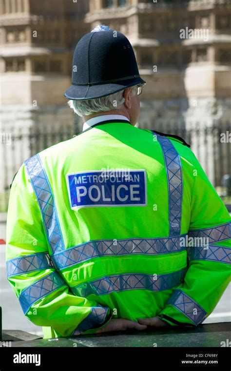 A Metropolitan Police Constable Wearing A High Visibility Uniform And