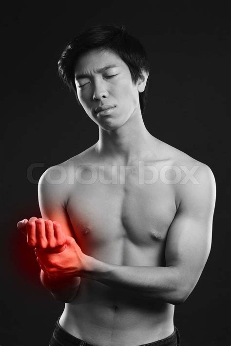 Man checking his pulse by pressing the wrist with fingers | Stock image ...