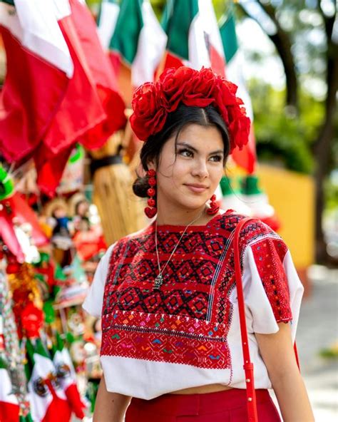 A woman in mexican clothing poses for a photo · Free Stock Photo