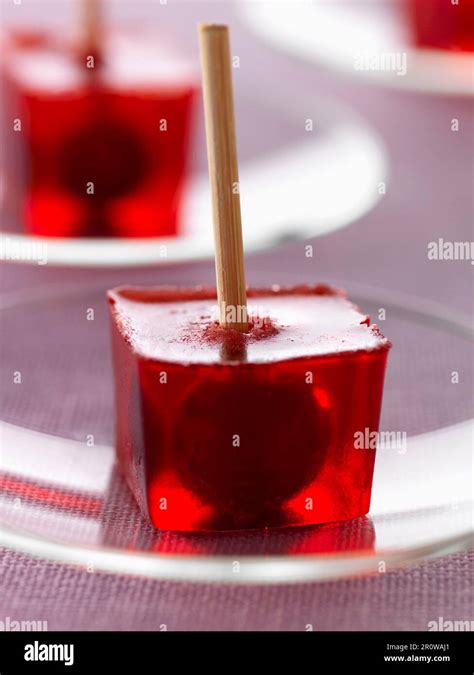 Cherry liqueur and small griotte cherry jelly cubes Stock Photo - Alamy