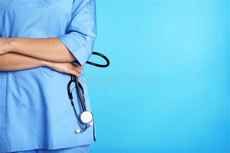 Medical Assistant With Stethoscope On Color Background Stock Image Image Of Confident Doctor