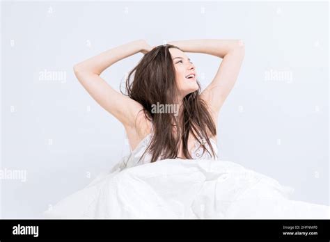 Wellness Concept A Young Beautiful Brunette Woman Wakes Up In Her Bed