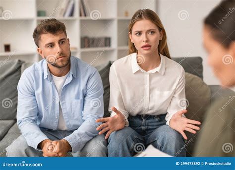 Husband And Wife Engage In Marital Counseling In Therapistand X27s