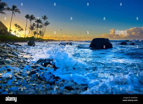 The sunrise over the beach in Kauai, Hawaii Stock Photo - Alamy