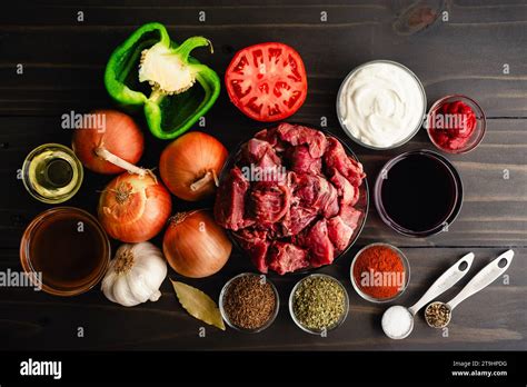 German Goulash Ingredients On A Dark Wooden Table Background Stew Meat