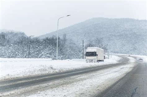 Big Commercial Semi Trailer Truck Trapped In Snow Drift On Closed