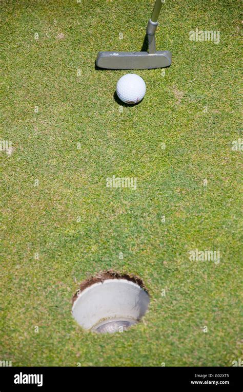 Golf Hole With Ball And Putt Stock Photo Alamy