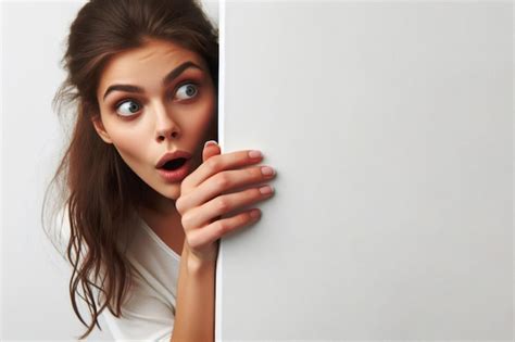 Premium Photo Surprised Woman Cautiously Peeks Around A Corner