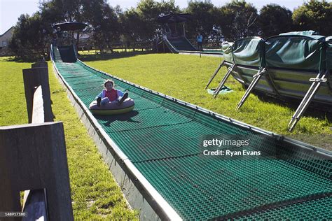 Girl On Tube Slide At The Enchanted Maze Garden Arthurs Seat High Res